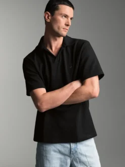 Oversized Poloshirt ohne Knopfleiste in Waffeloptik Schwarz