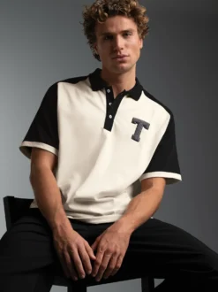 Poloshirt mit Raglanärmeln und trigema Brustpatch Natur